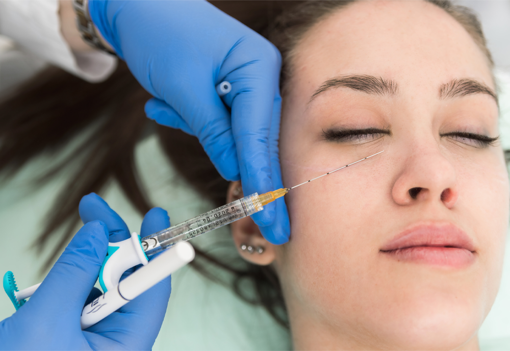 Closeup cropped image doctor's hands injecting substance underneath patinet's eyelid, Corrective medicine concept